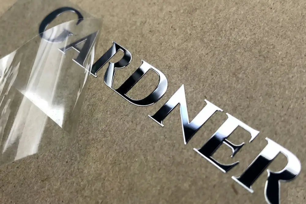 Elegant gold and silver electroformed nickel labels, corrosion resistant and fade-proof for long-term luxury product decoration.