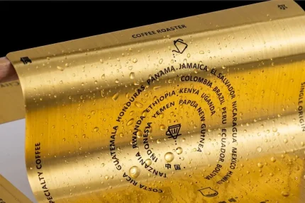 Luxury brushed gold PET labels with elegant metallic texture for high-end product branding and cosmetic packaging.