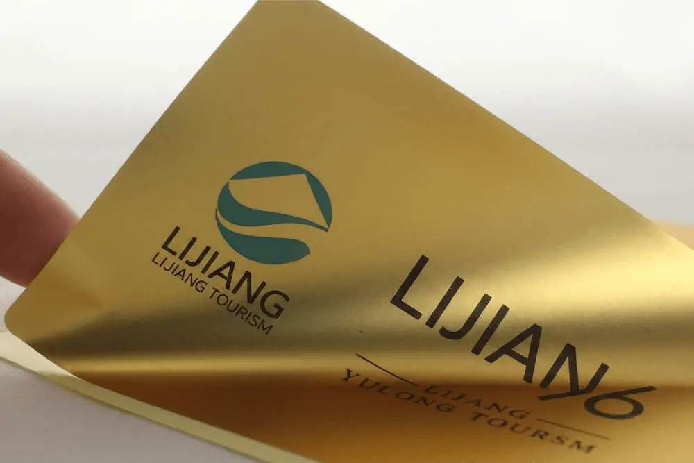 Custom printed bright gold polyester labels with a shiny metallic finish and high-tack adhesive for premium product branding.
