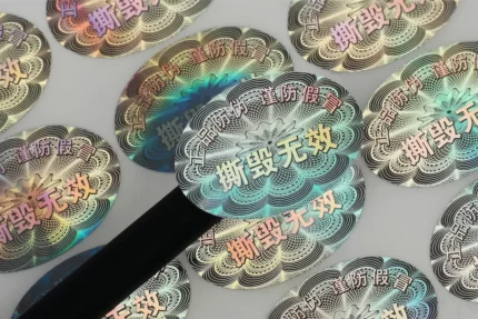Custom 3D laser holographic labels with honeycomb texture, offering high-visibility authenticity verification for high-end electronics and luxury goods.