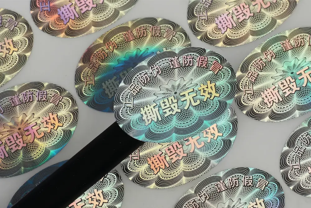 Custom 3D laser holographic labels with honeycomb texture, offering high-visibility authenticity verification for high-end electronics and luxury goods.